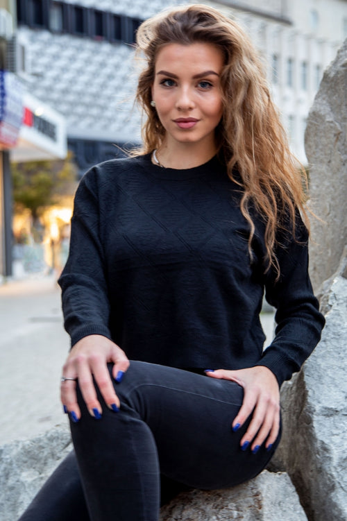 Modern loose-fit cable-knit sweater