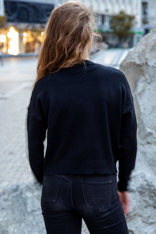 Modern loose-fit cable-knit sweater