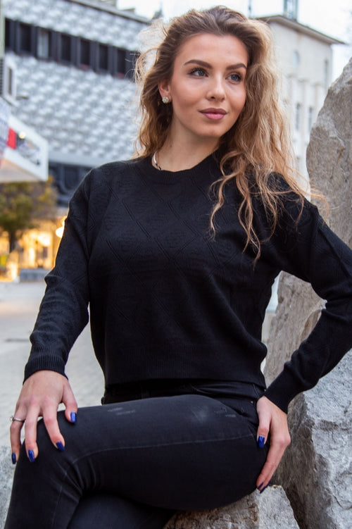 Modern loose-fit cable-knit sweater