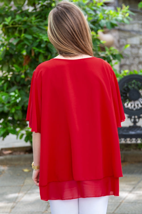 Plain plus-size women's blouse with complimentary accessory