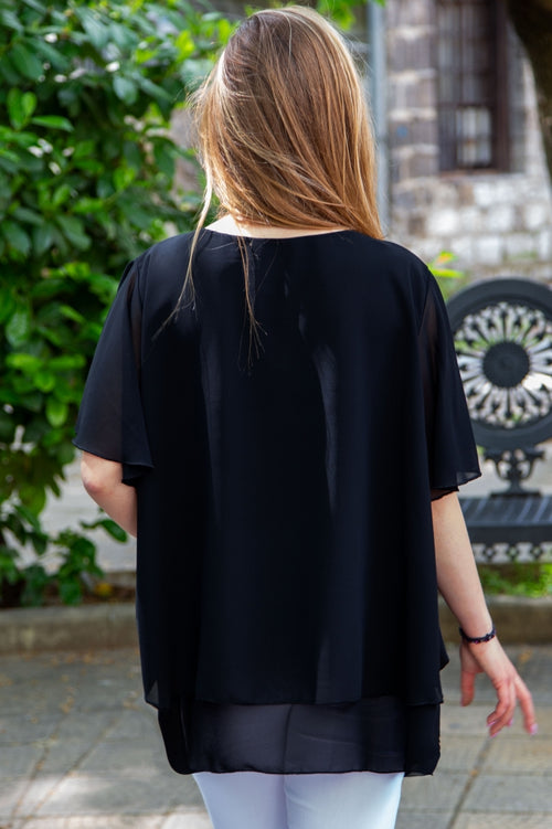 Plain plus-size women's blouse with complimentary accessory